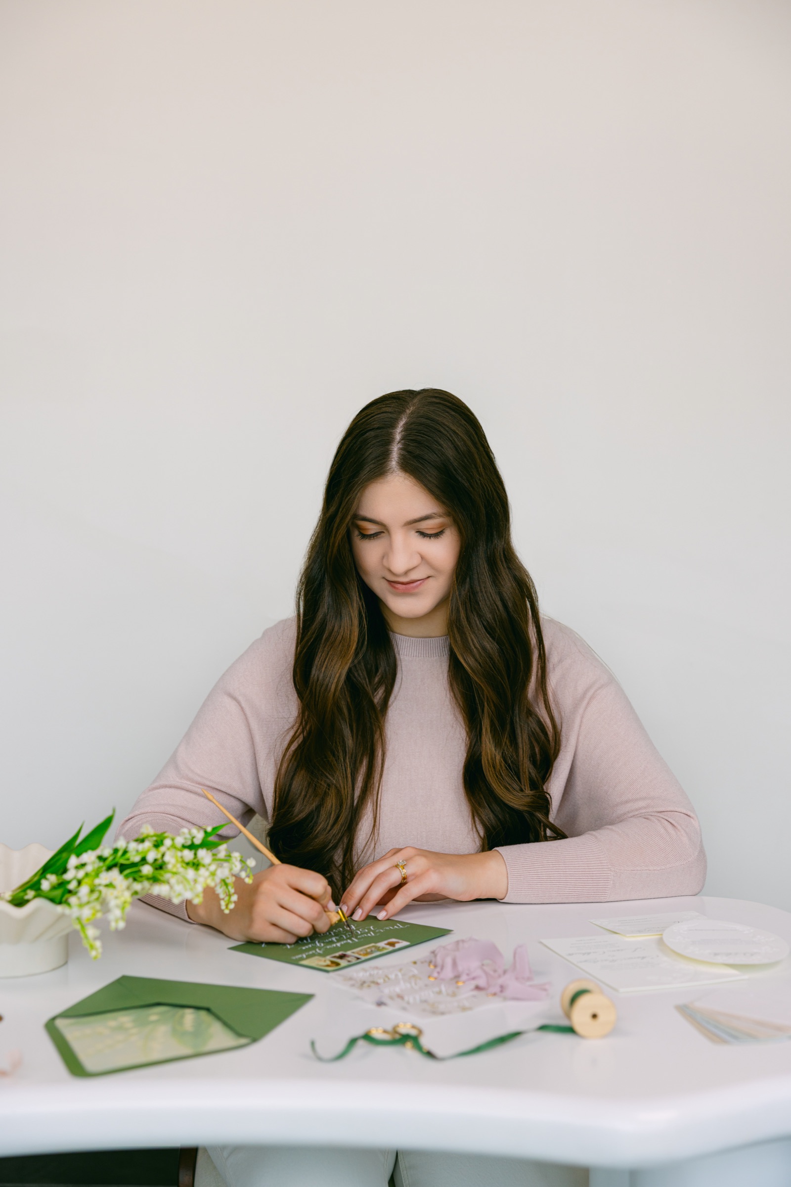 Karena Vetan at her calligraphy desk
