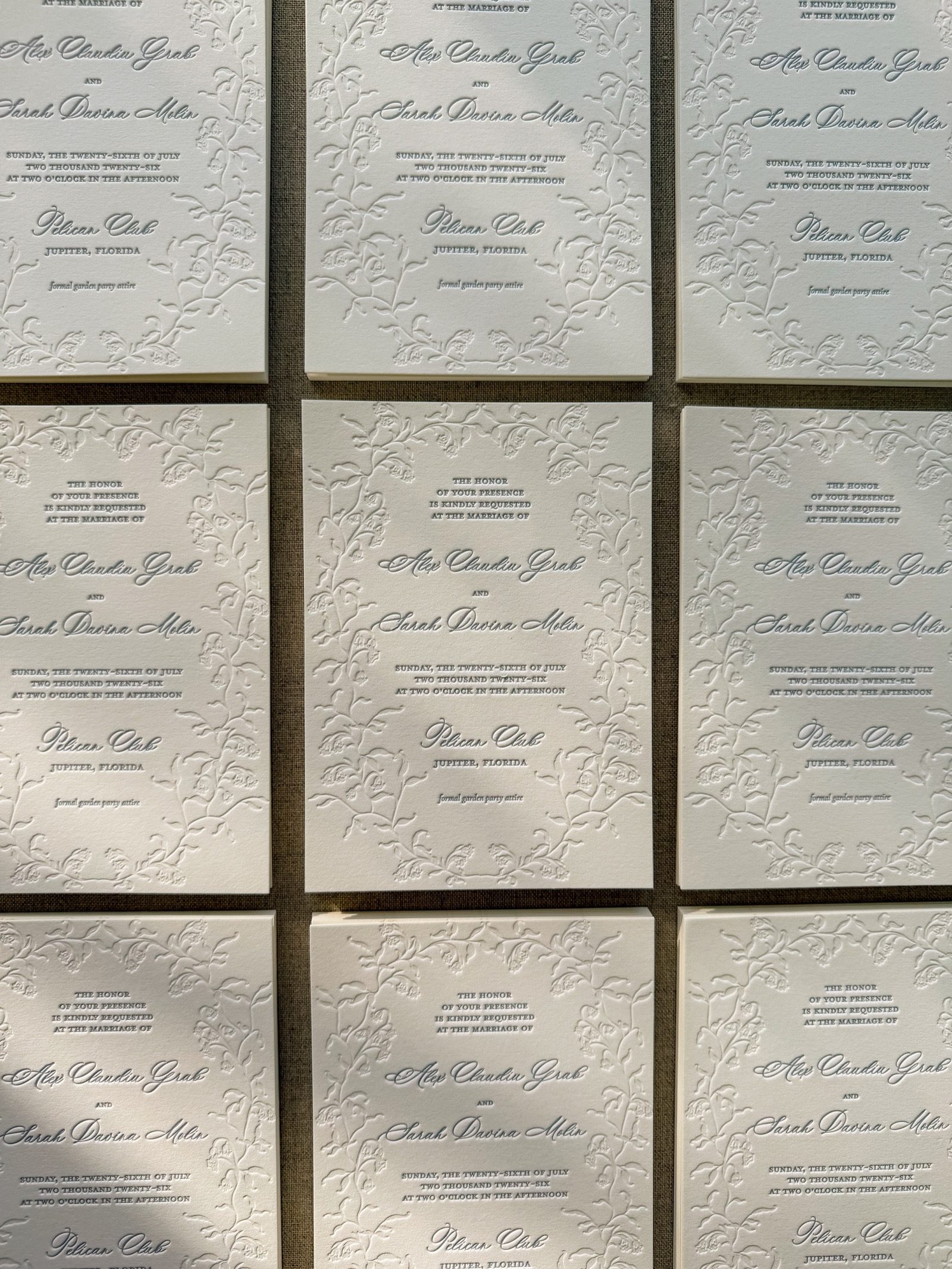 Letterpress wedding invitations with embossed florals